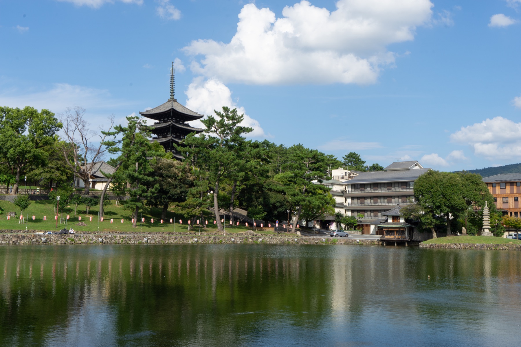Sarusawa Pond with trees and the five-storey pagoda of Kofukuji beyond